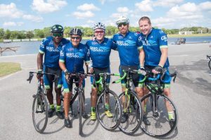 A group of cyclists posing for a photo.