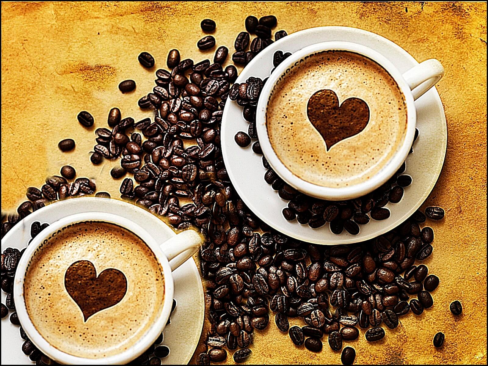 A cup of coffee with a heart on it.